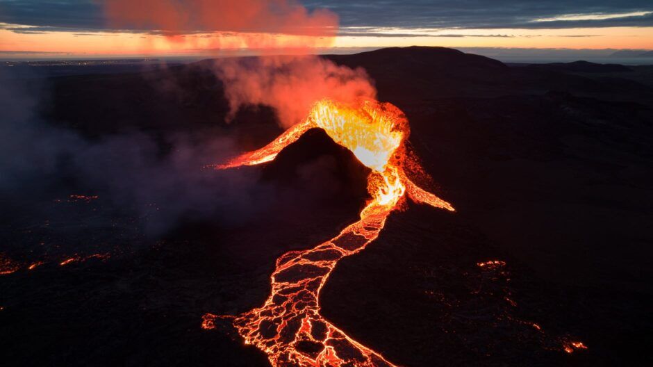 orange and white lightning on black sand