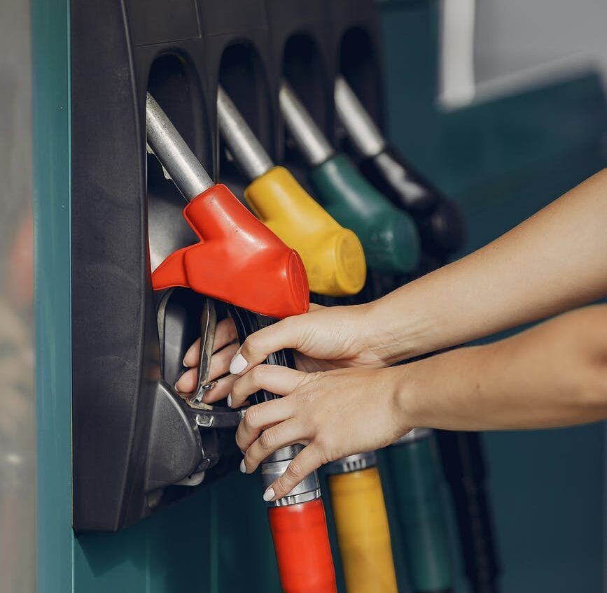 nedostatok motorová nafta crop woman taking refueling pistol gun
