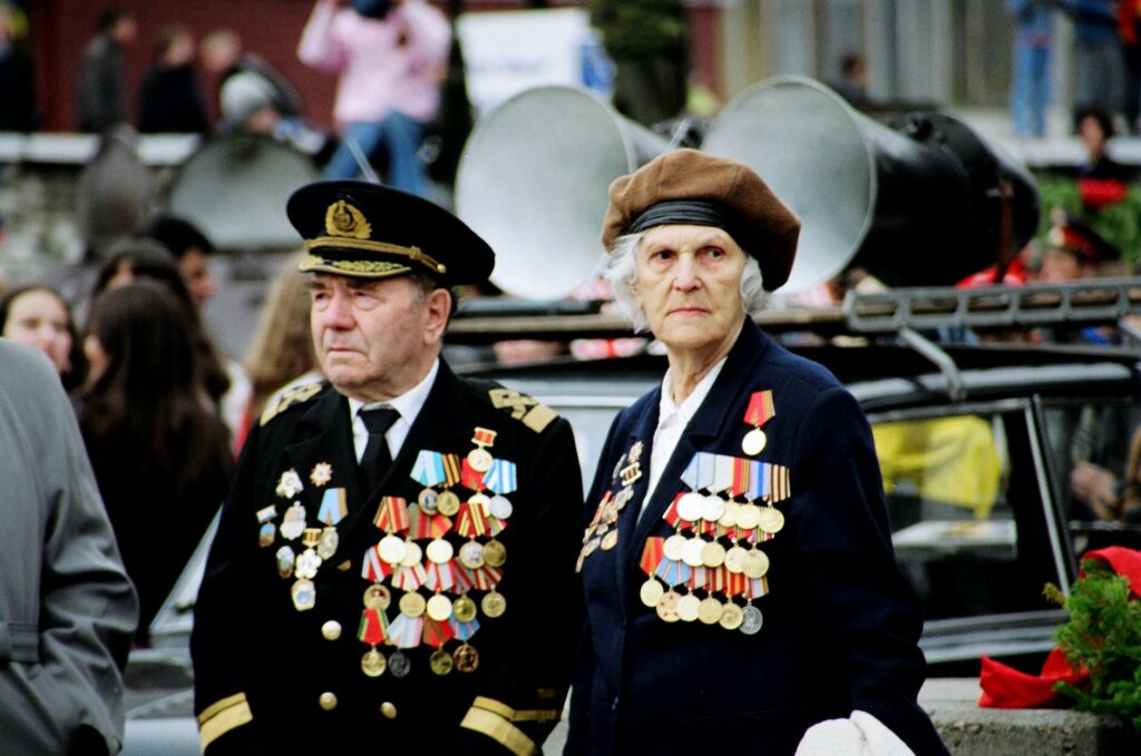 shallow focus photo of two persons wearing military uniform