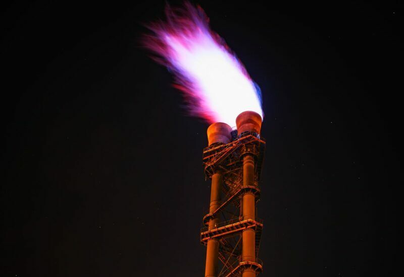 low angle view of illuminated tower against sky at night
