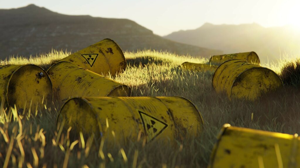 nuclear waste barrels on a grassy field