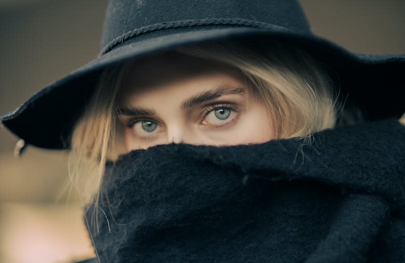 Womans Face Covered with Scarf
